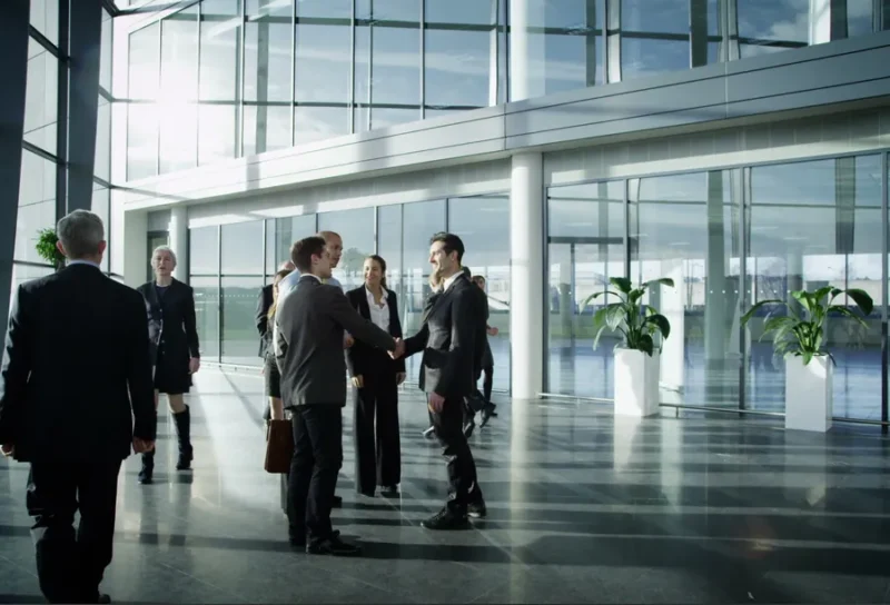 Professionals meeting in a light-filled office.